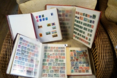 009-4-Stamp-Albums-containing-World-Stamps