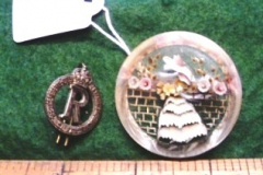 0415-Crinoline-Brooch-Made-of-Aeroplane-Glass-and-Cap-Badge