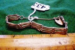 0433-9ct-Locket-on-Yellow-Metal-Bracelet